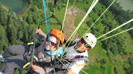 Overhead paragliding shot with Altitude Adventures company