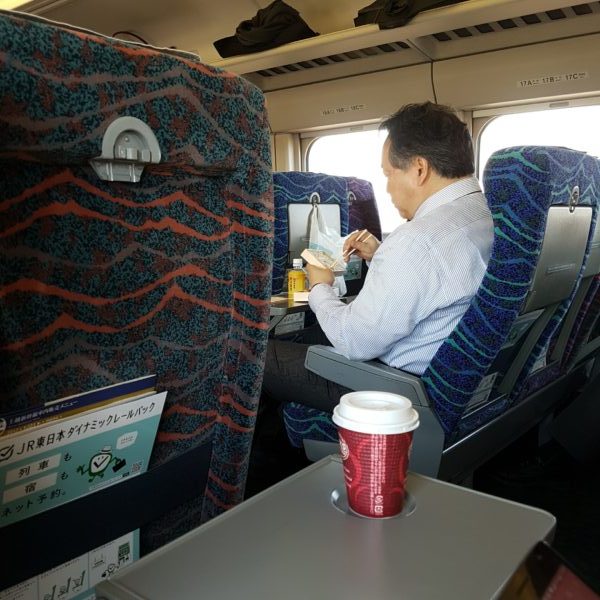 A man enjoying lunch on the train in Japan