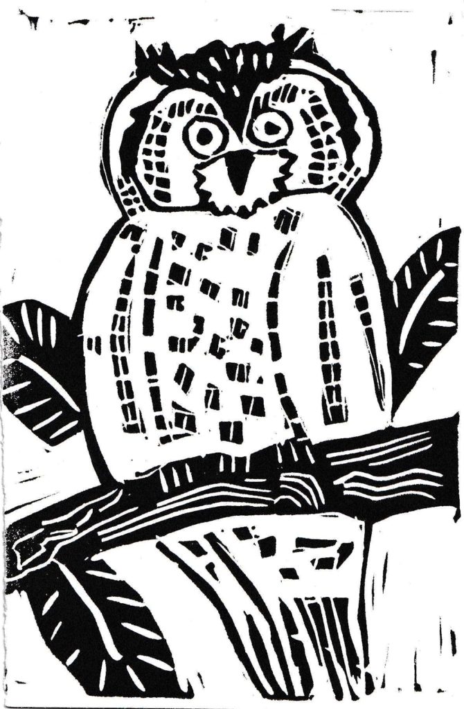 Linocut of an owl sitting on a tree branch