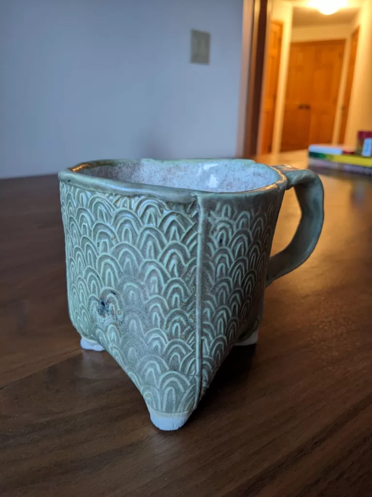 Three Footed Pottery Mug Design - imprinted with a Japanese Wave print pattern.
